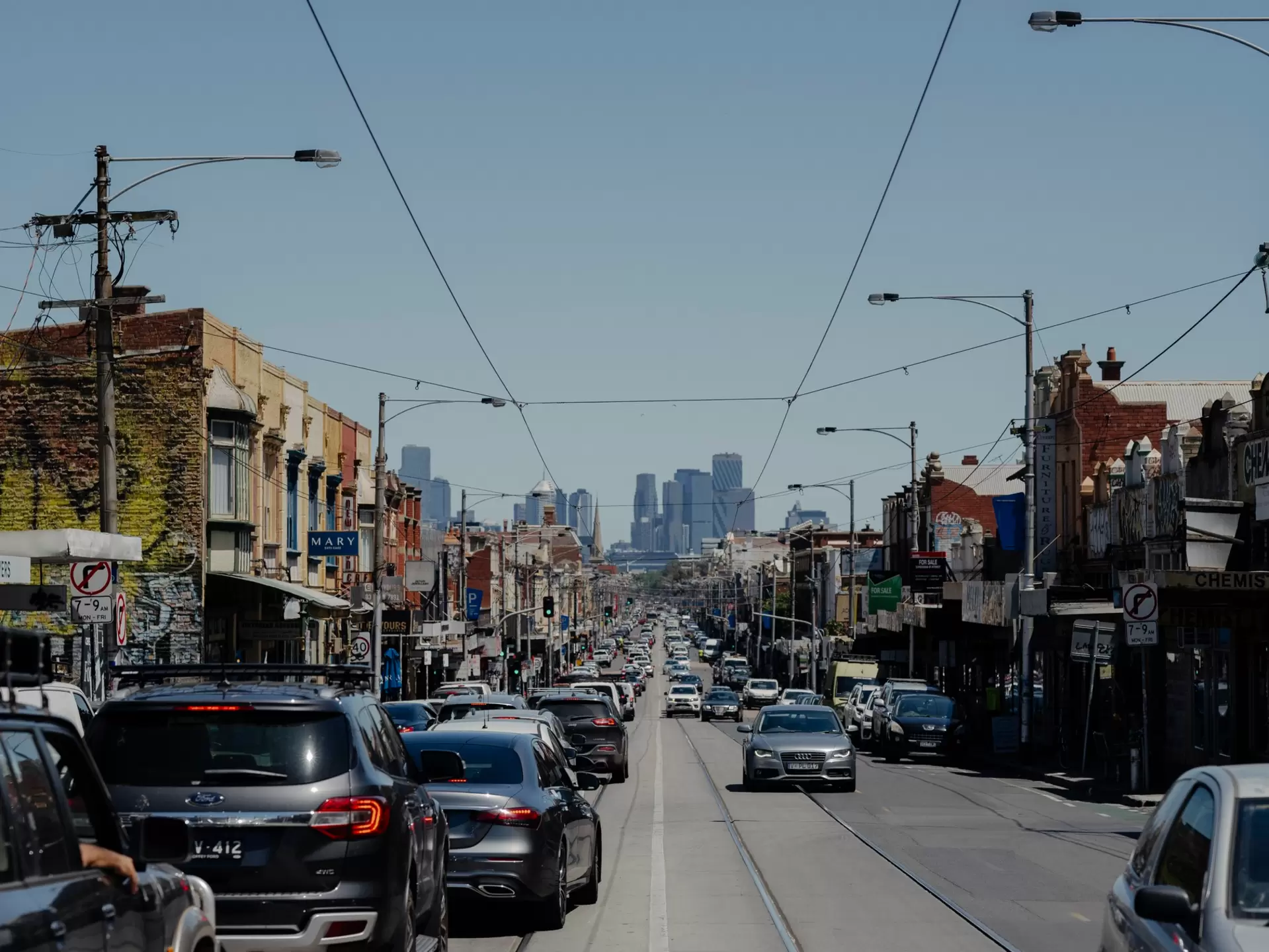 View of Melbourne city from Brunswick with cars and trams
