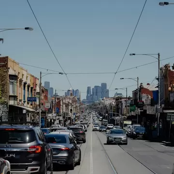 View of Melbourne city from Brunswick with cars and trams