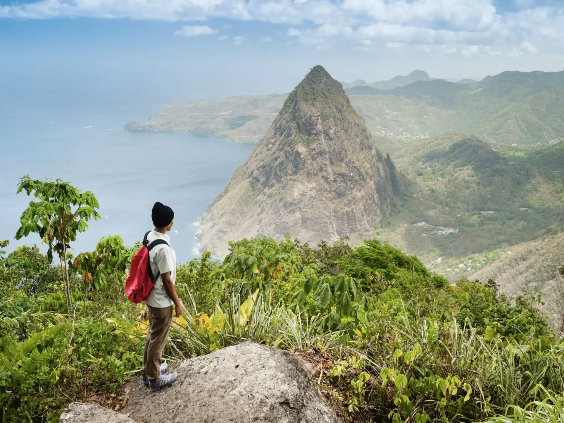 A hiker looks out at Petit Piton from the top of Gros Piton, St Lucia3. Justin Foulkes for Lonely Planet
