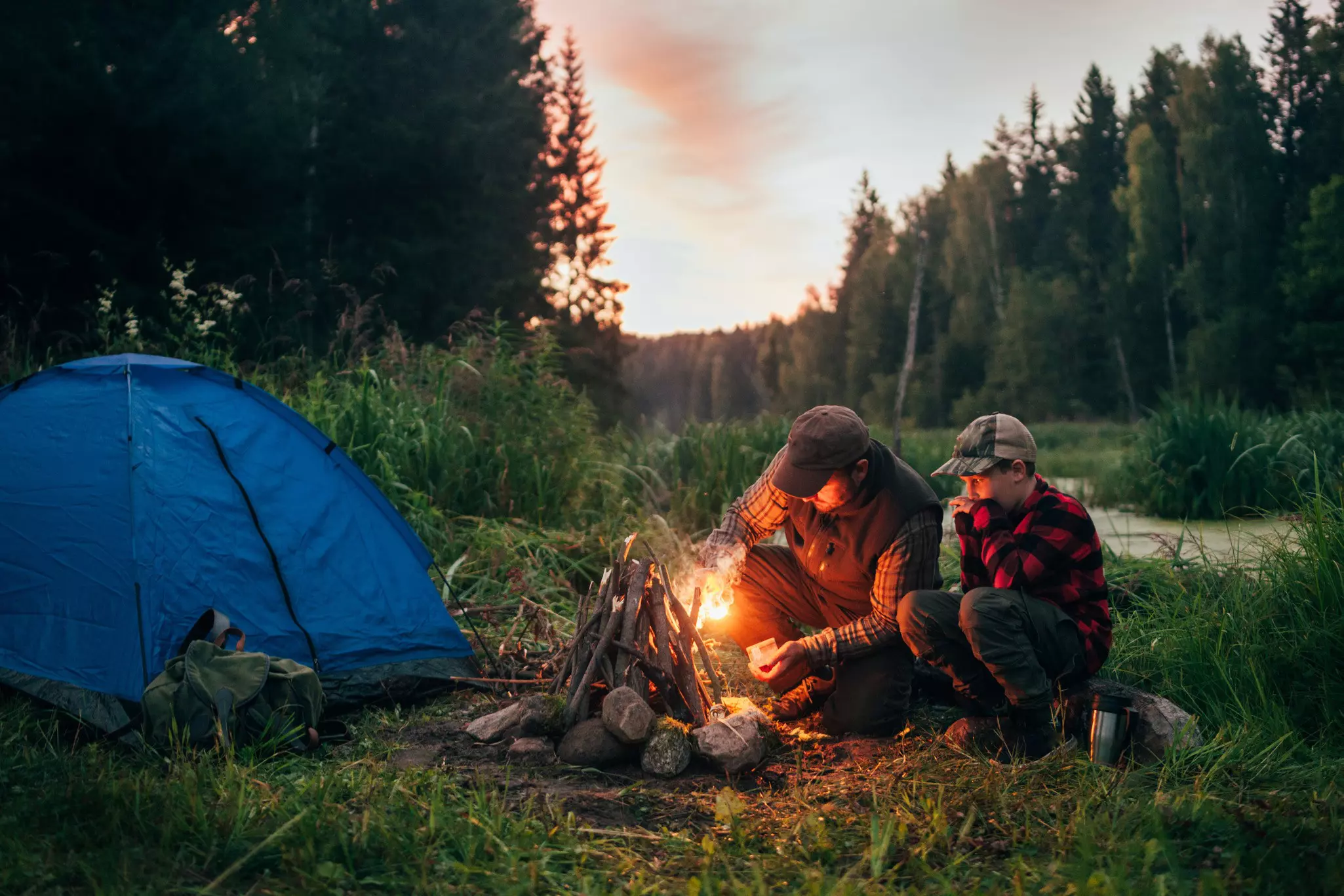 Father and son camping together in Estonia