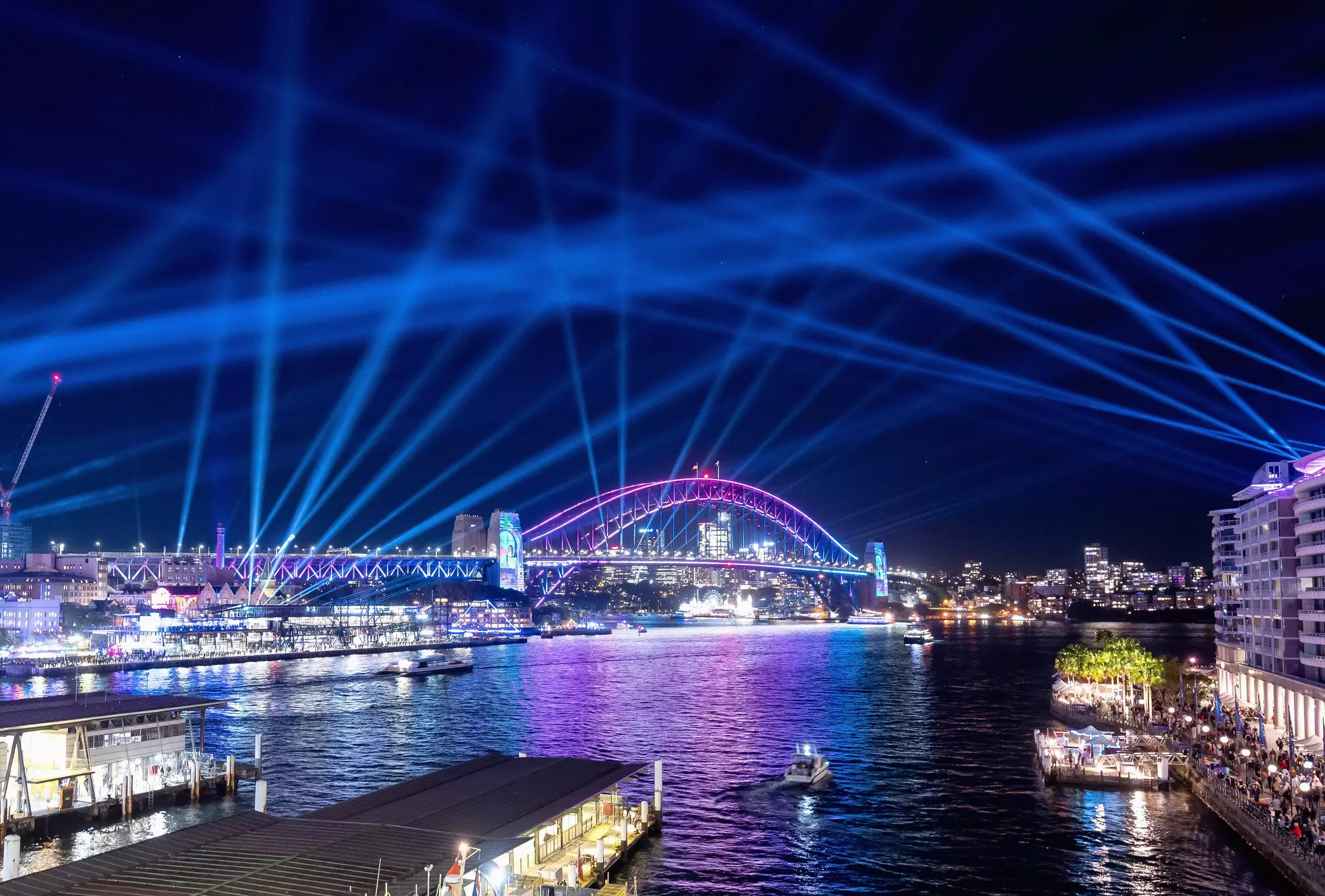 Grab a table at an outdoor waterfront bar to take in the illuminations of Vivid Sydney © James D. Morgan / Getty Images for Destination New South Wales