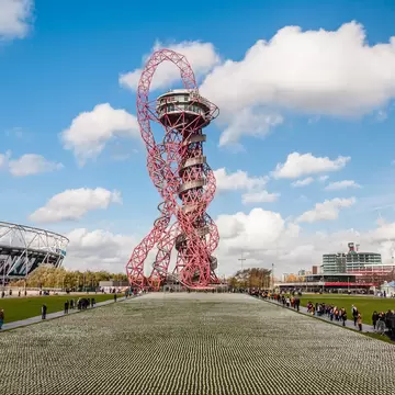The Shrouds of the Somme artwork, which features 72,396 small human figurines, each separately wrapped in a calico shroud. The ArcelorMittal Orbit tower is in the background.
1226333209
arcelormittal orbit, architecture, armed forces, attraction, battlefield, blue, building, capital, centenary, city, cityscape, commemorate, elizabeth, england, entertainment, first, forces, france, graveside, killed, kingdom, landmark, london, olympic stadium, park, queen elizabeth, remembrance, rob heard, service men, shrouds, sky, somme, stratford london, street, tourism, tourist, town, travel, urban, view, war, wheel, world