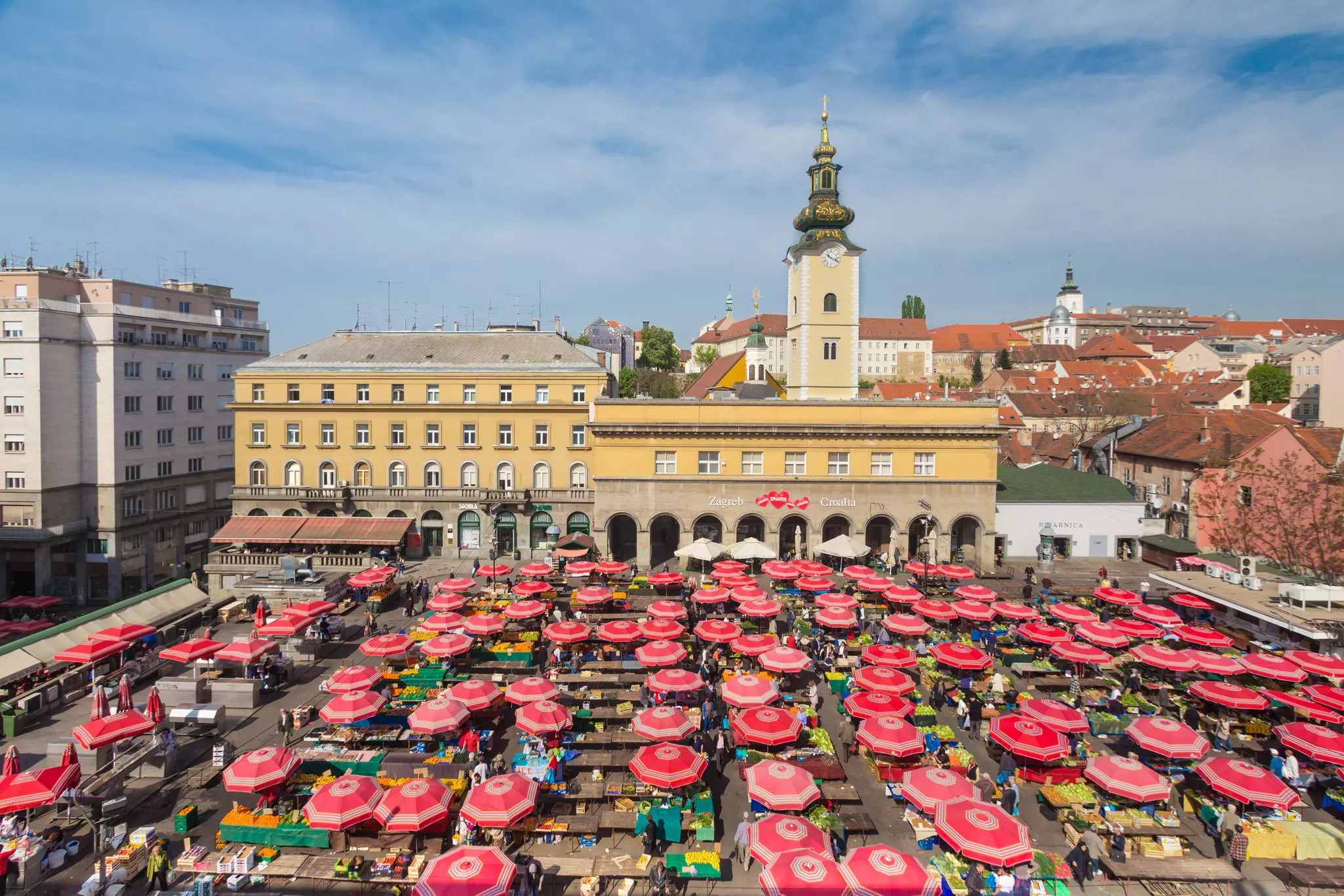 Aerial view of Dolac Market in Zagreb covered with parasols and stalls selling fresh fruit and vegetables.