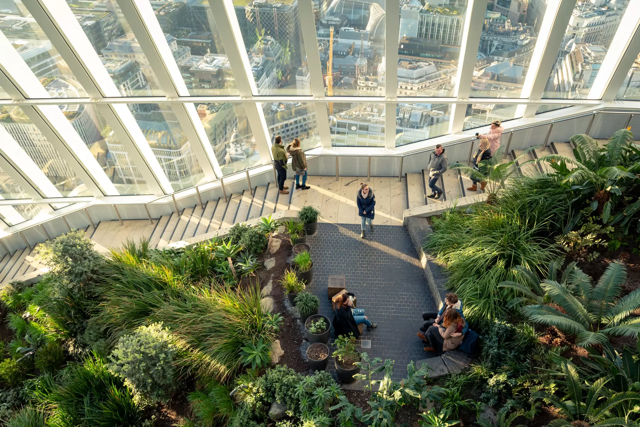 Visitors looking at the views from Sky Garden in London, UK.