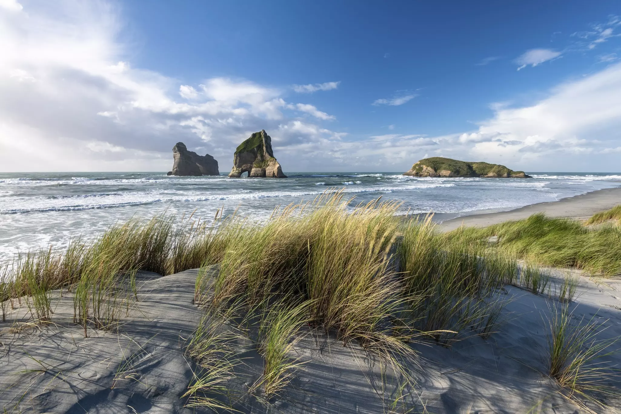 Rock island on Wharariki beach, Wharariki Beach, Golden Bay, Southland, New Zealand, Oceania