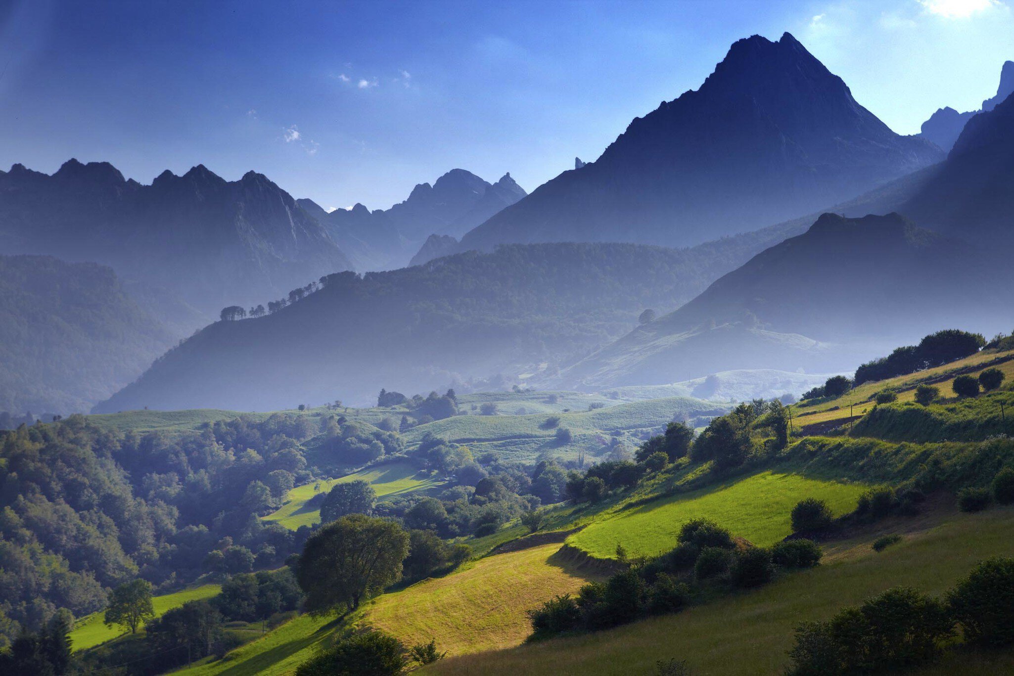 Overview of stepped farmland and Pinnacle of Pic du Jer.