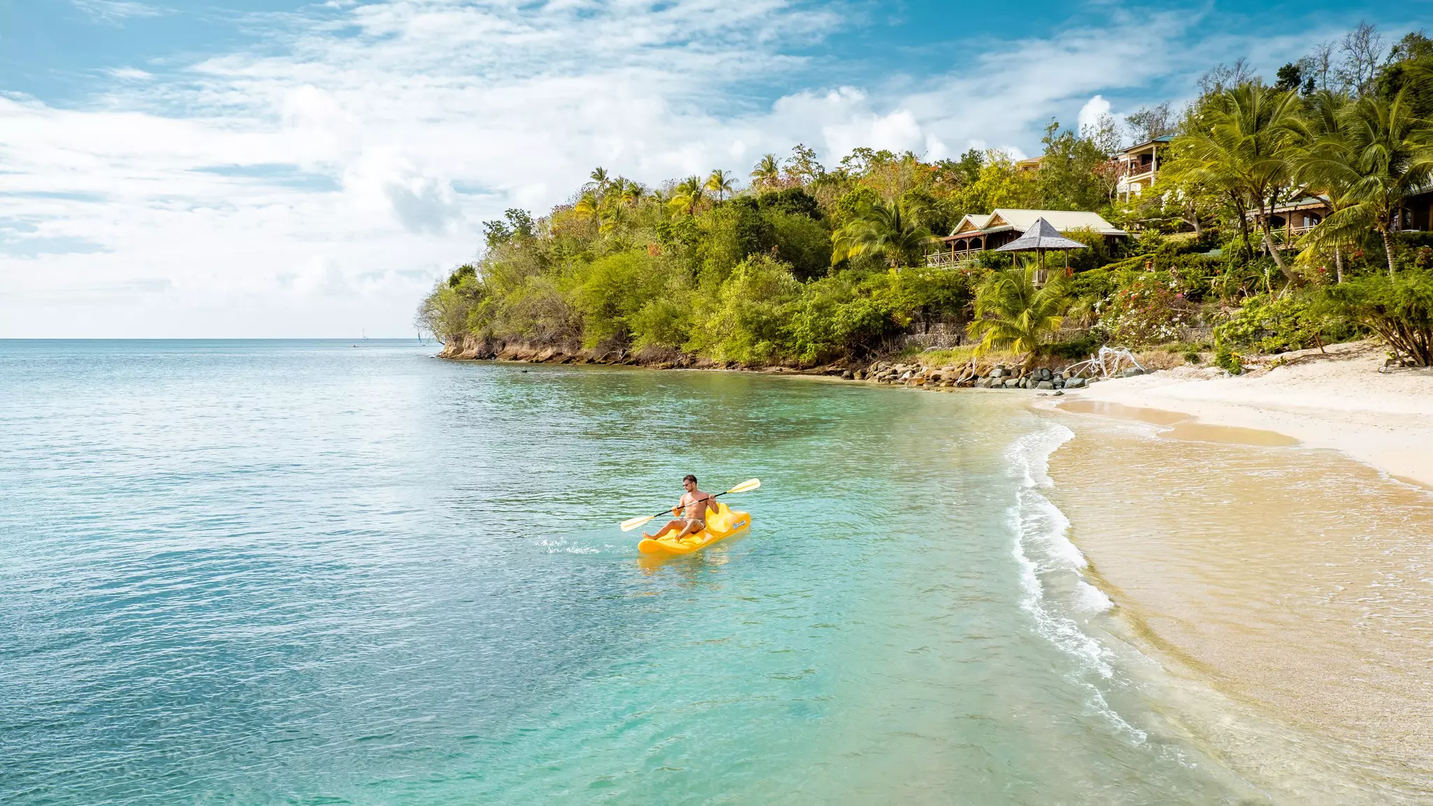 Encourage your teens on to a sea kayak on the serene Caribbean sea © fokke baarssen / Shutterstock