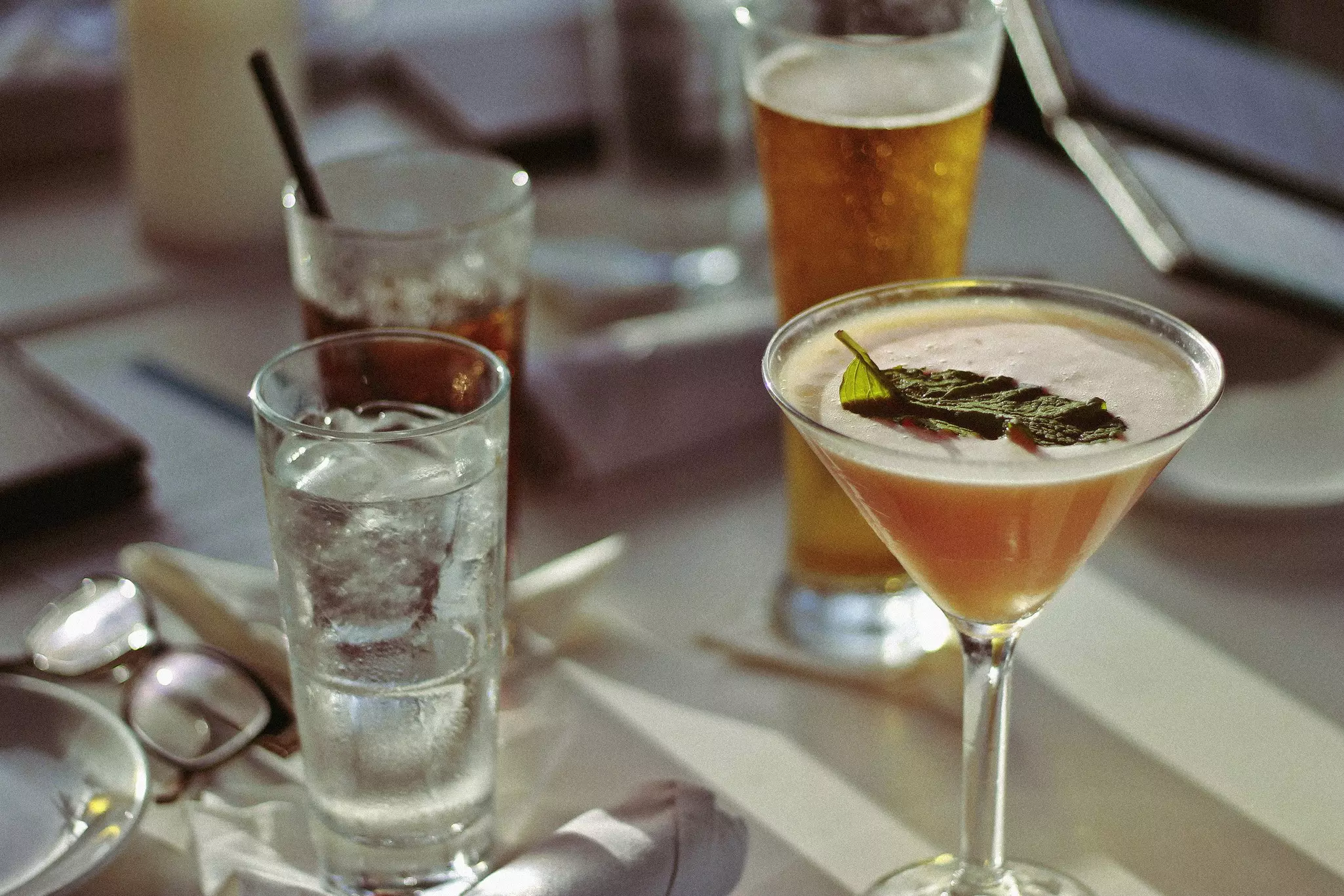 Cocktails, beer and rum on a bar table in San Juan, Puerto Rico