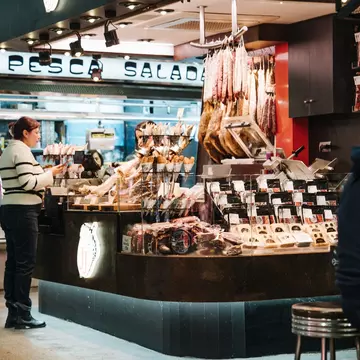 People visiting the local market hall, Mercat de Sant Antoni, in Barcelona, Spain.