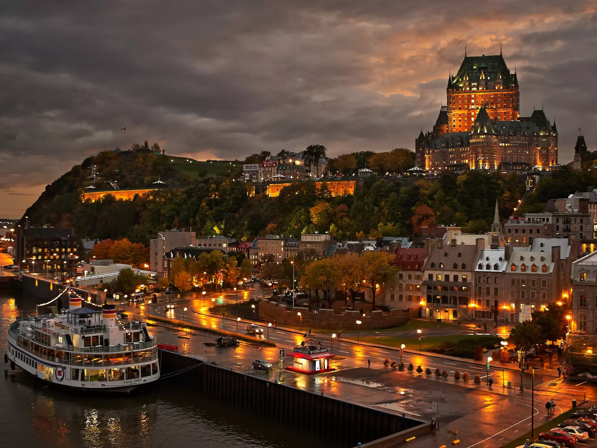 Quebec City after the rain at dusk with view of Le Chateau Frontenac on top of the hill.