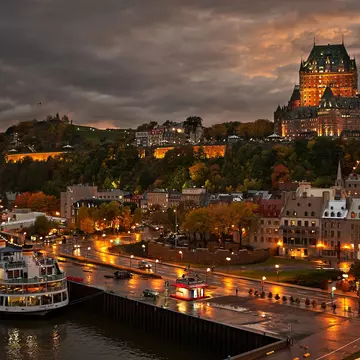 Quebec City after the rain at dusk with view of Le Chateau Frontenac on top of the hill.