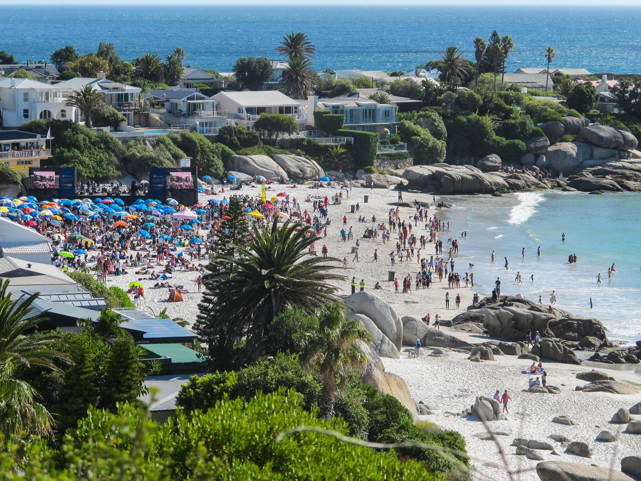 Cape Town - February 14, 2015:  aerial view or looking down onto Clifton 4th beach filled to capacity with people or beachgoers on Valentines day for a special open air concert event; Shutterstock ID 1512645083;