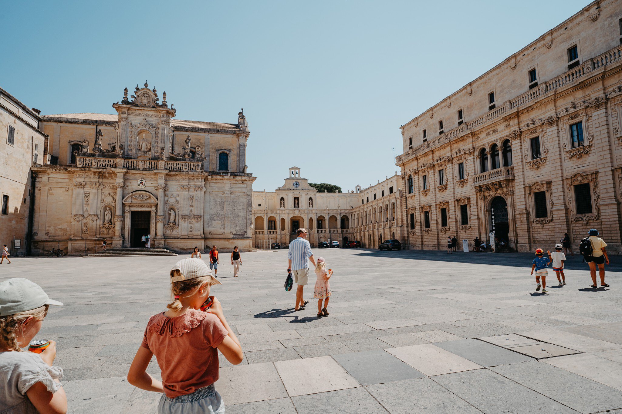 People walk through the Piazza del Duomo in Lecce, Puglia.