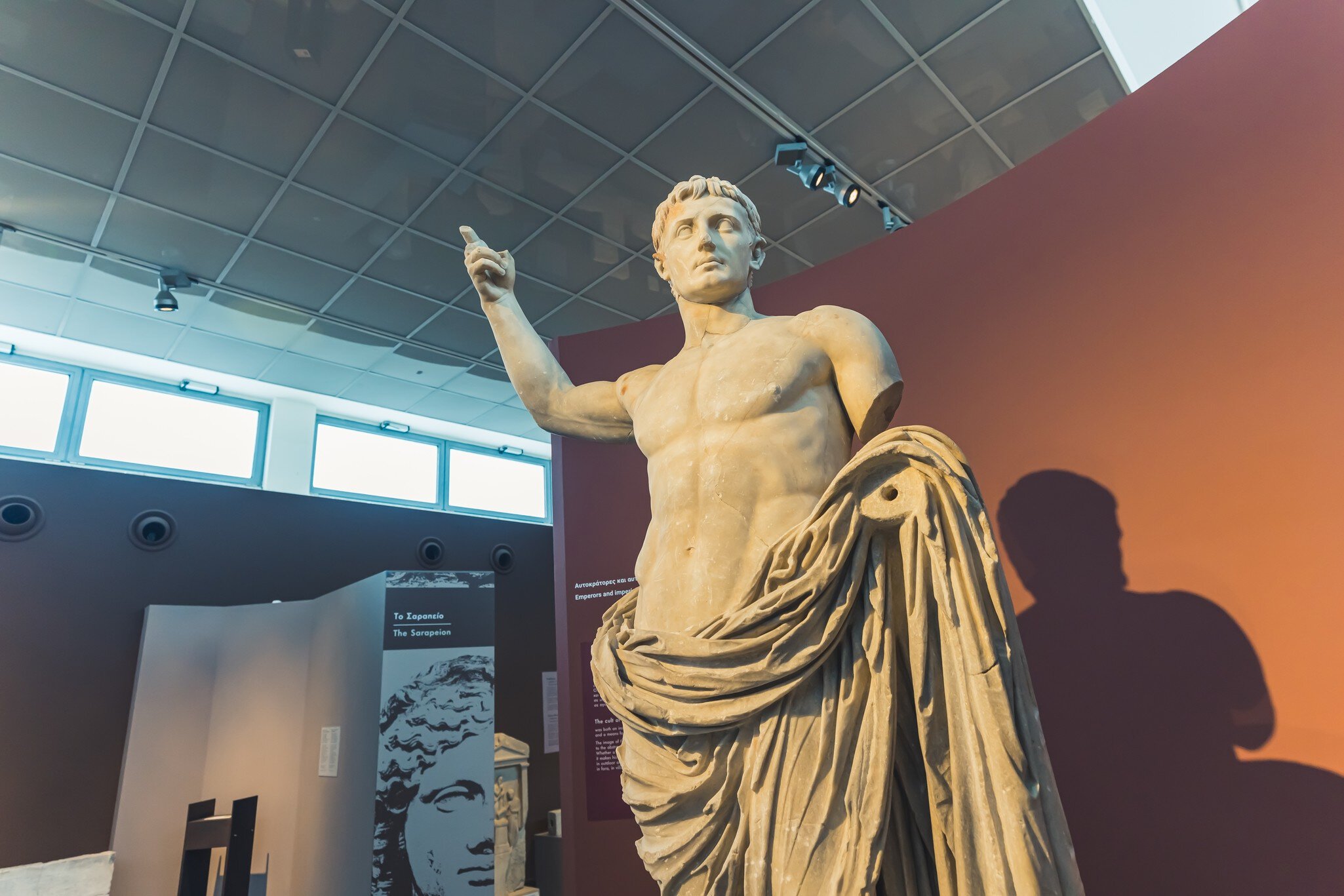 07.13.2022 Thessaloniki, Greece. Beautifully preserved artwork statue of a muscular short-haired man with a naked torso covering with cape. High quality photo; Shutterstock ID 2194941033; your: Barbara Di Castro; gl: 65050; netsuite: digital; full...