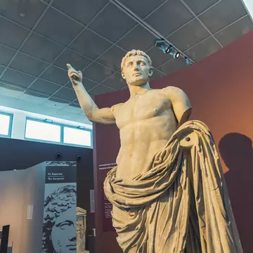 07.13.2022 Thessaloniki, Greece. Beautifully preserved artwork statue of a muscular short-haired man with a naked torso covering with cape. High quality photo; Shutterstock ID 2194941033; your: Barbara Di Castro; gl: 65050; netsuite: digital; full...
