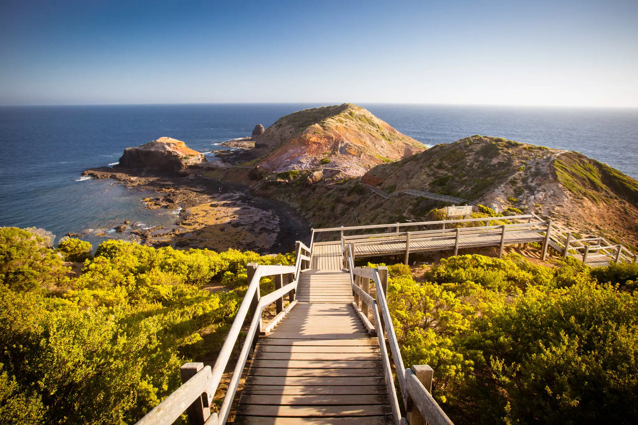 The famous Cape Schanck boardwalk runs towards the sea and rock formation known as London Bridge, in Victora. Australia