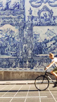 Lonely Planet Magzine, Issue 122, December 2018, Porto Portugal
A male cyclist rides past Azulejo tiles on the church walls of Capela das Almas.