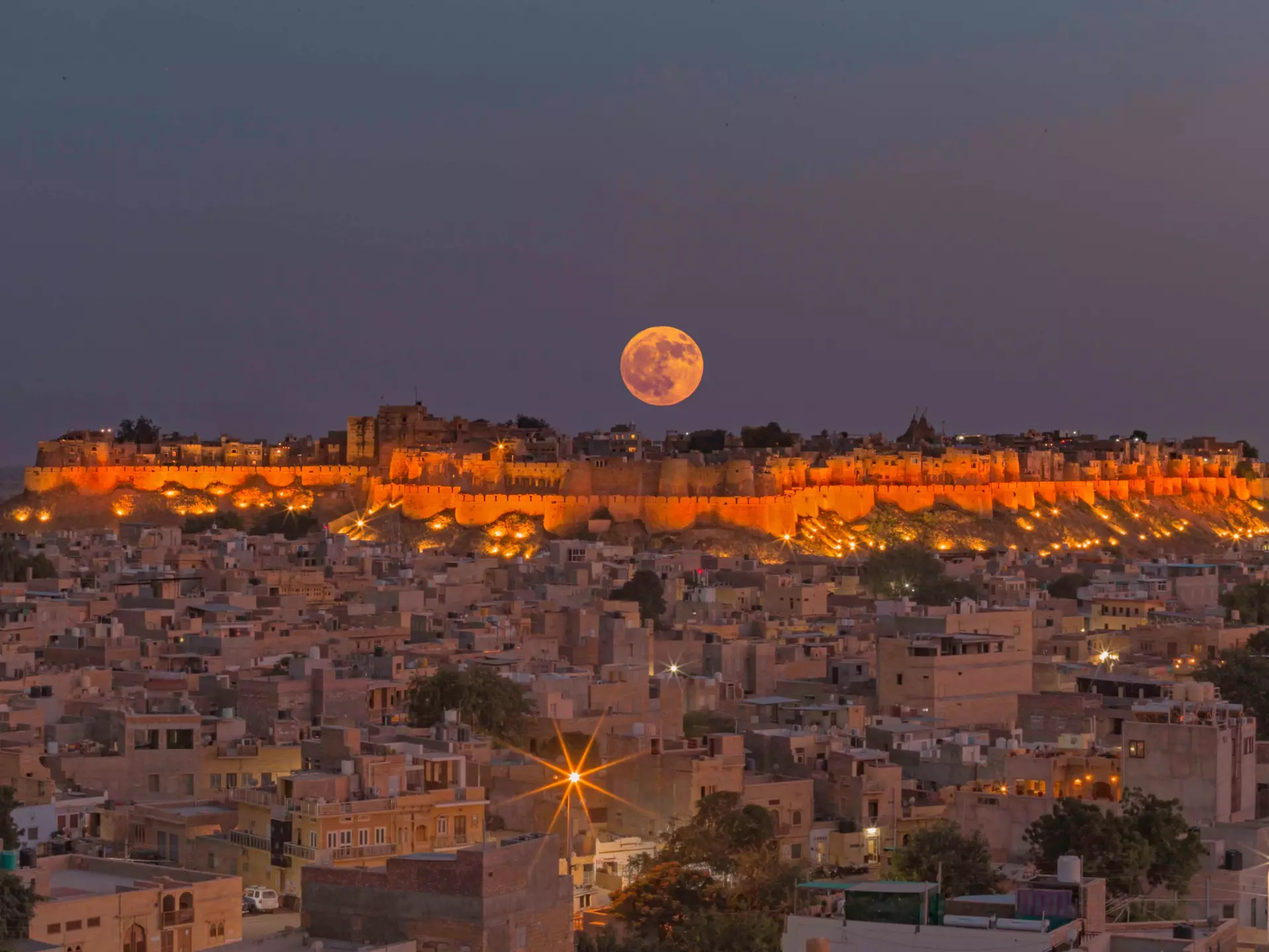 The moon rises over the walls of Jaisalmer Fort. Sayan Nath/Shutterstock