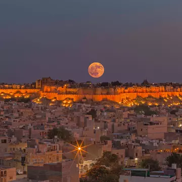 The moon rises over the walls of Jaisalmer Fort. Sayan Nath/Shutterstock