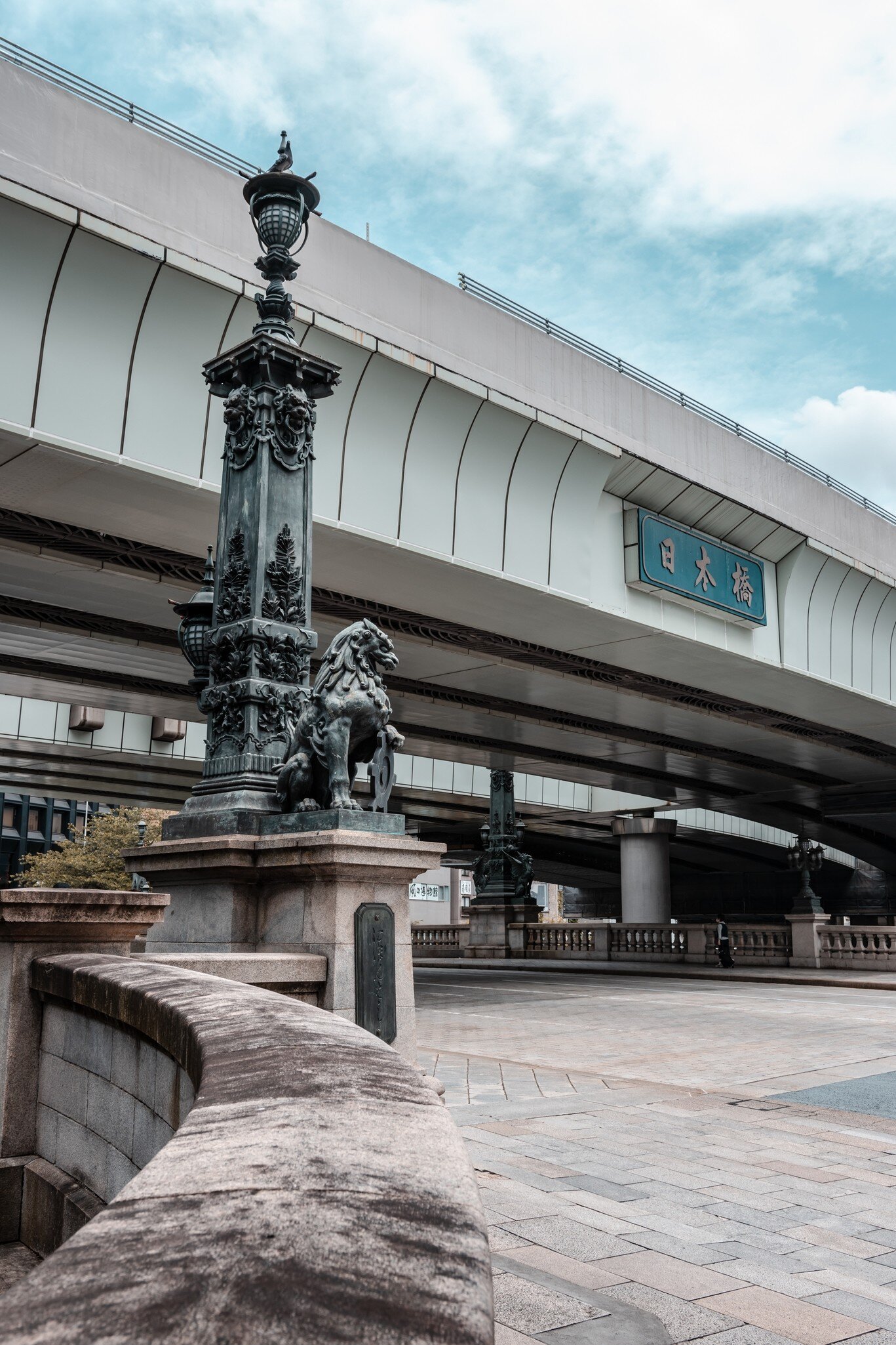 Tokyo, Japan - 05.2022: Nihonbashi Bridge with lion statue, one of the most historic bridge in Japan since Meiji era. One of the most popular tourist destinations in Tokyo metropolitan area.  License Type: media  Download Time: 2024-05-28T14:31:56.000Z  User: aniabartoszek  Is Editorial: Yes  purchase_order:   