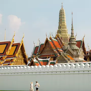 Bangkok, Thailand - Sep,2018 - Tourist couple walking at Wat Phra Kaew,A Bangkok Grand Palace in Thailand, License Type: media, Download Time: 2025-02-11T20:28:38.000Z, User: rhylton_redventures, Editorial: true, purchase_order: 65030 - Newsletter, job: Lonely Planet WIP, client: Lonely Planet WIP, other: Rhianydd Hylton