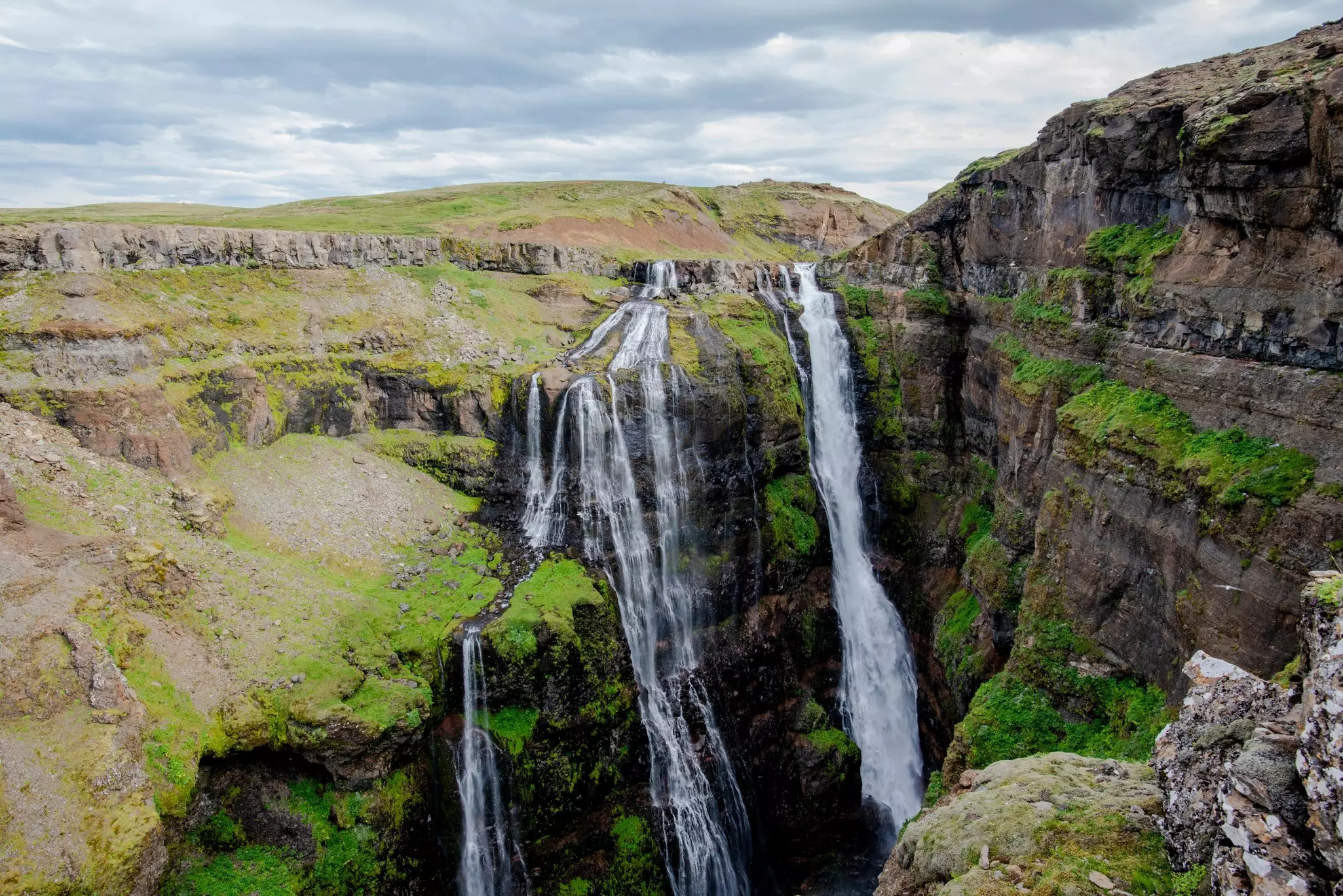 view of the beautiful Glymur waterfalls on the Botsná river from the Hvalvatn lake near the Hvalfjörður fjord in Iceland,