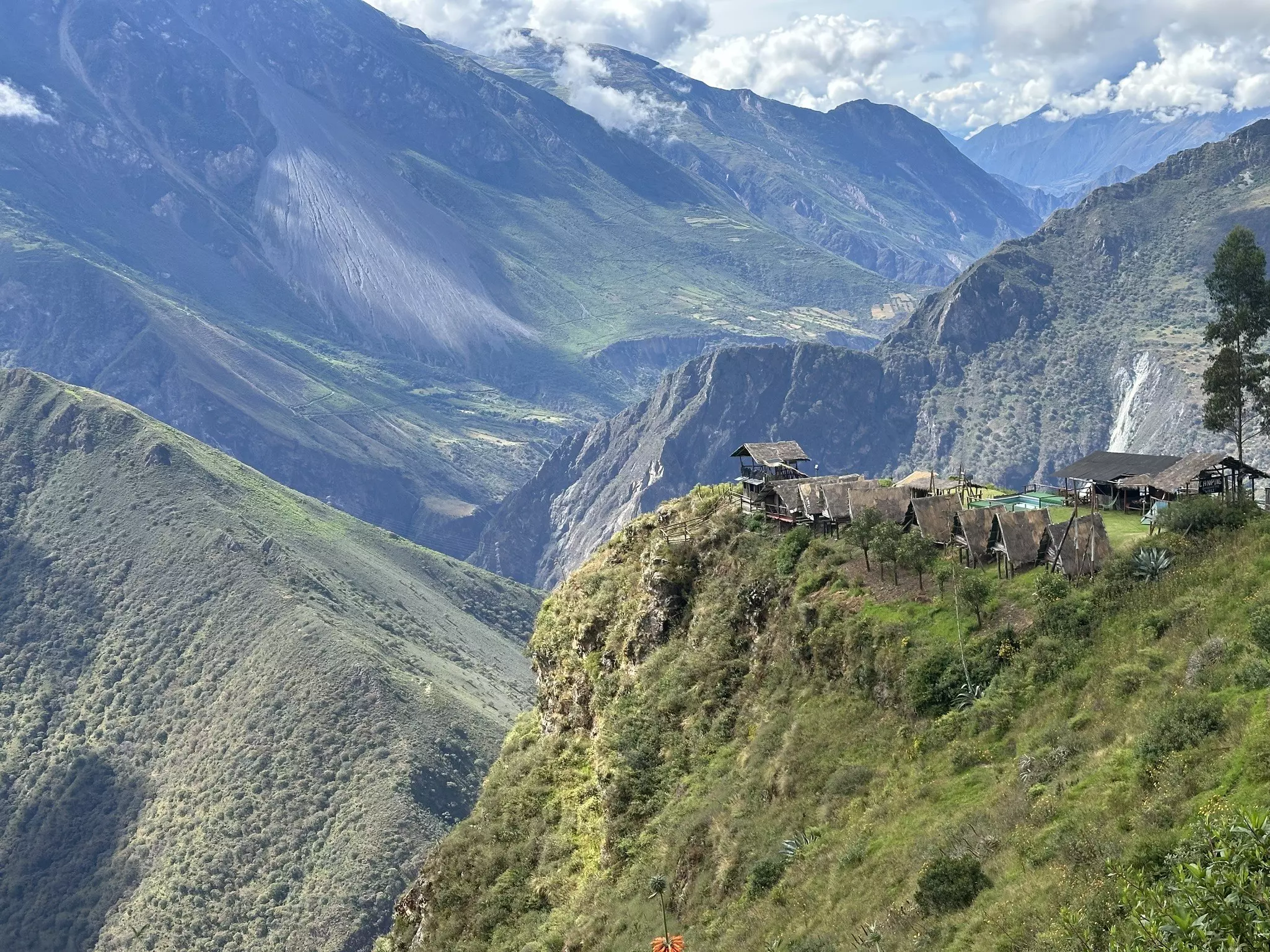 A campsite with grassy mountains in the background