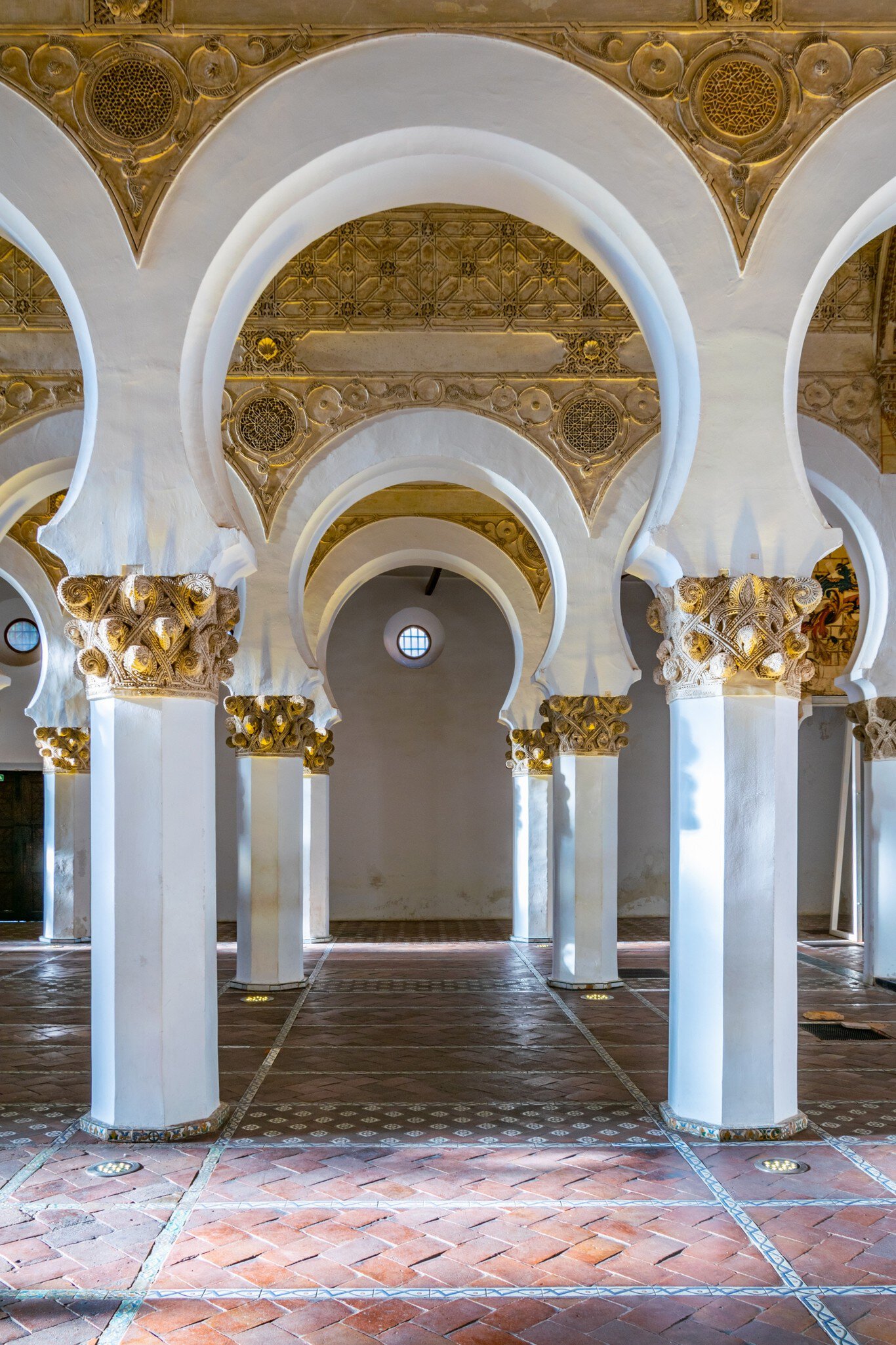 White arches at the Sinagoga de Santa María La Blanca in Toledo, Spain.