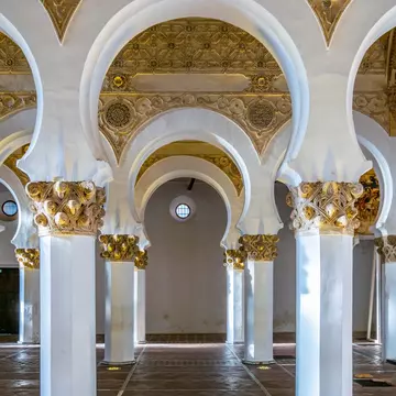 White arches at the Sinagoga de Santa María La Blanca in Toledo, Spain.