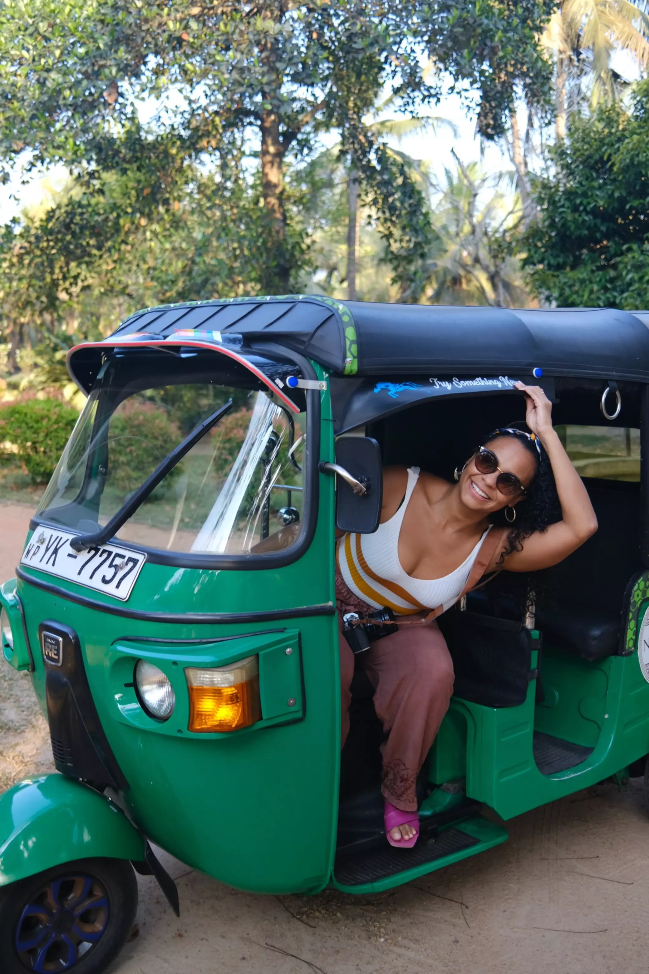 Jo Franco driving a Tuk Tuk in Sri Lanka