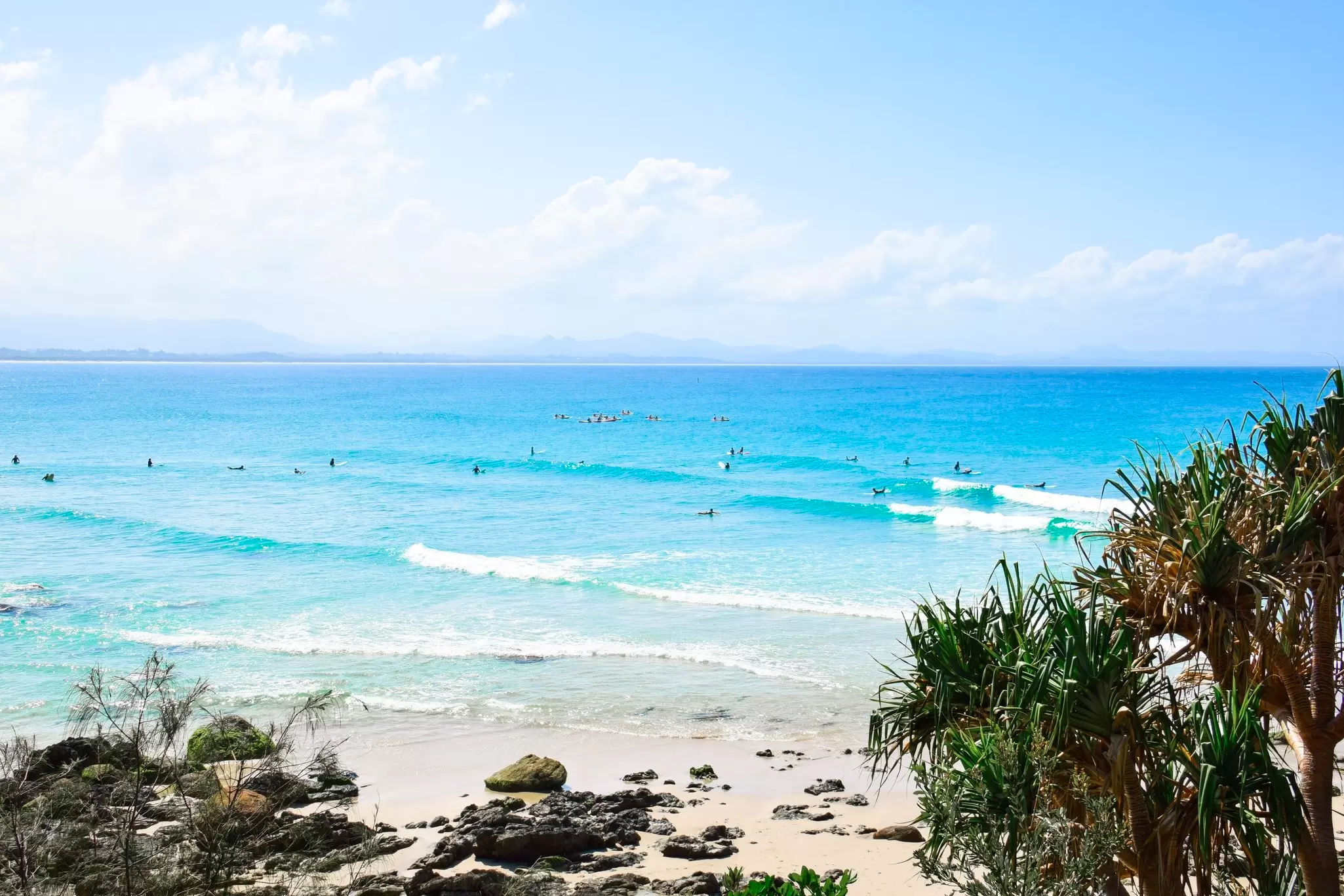 Turquoise-waters lap onto a sandy shoreline