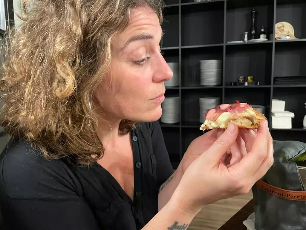 Writer Virginia with the signature “five consistencies of onion” pizza