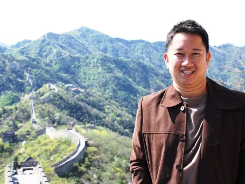James Pham with the Great Wall in the background