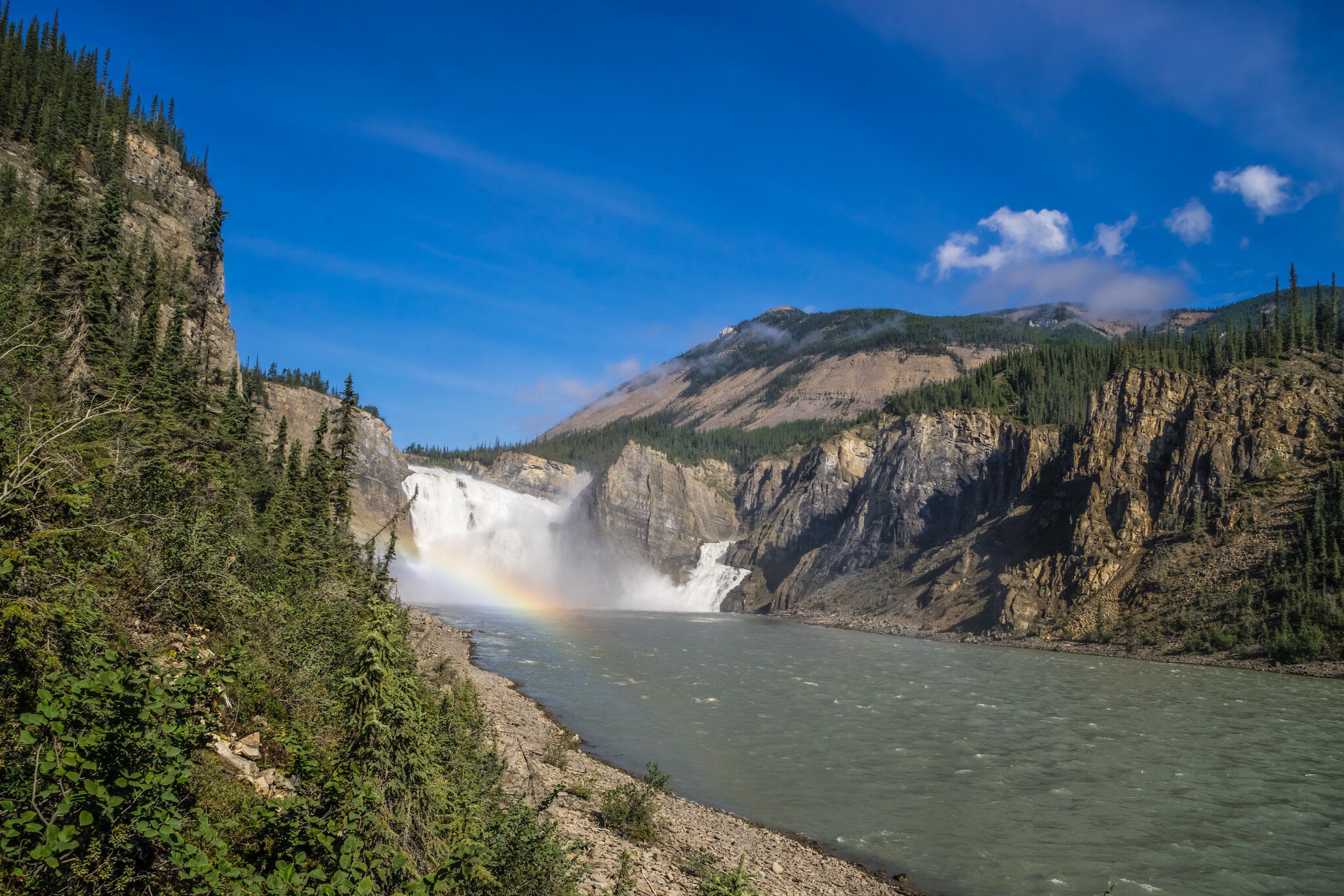 Virginia Falls in mist and water mist rainbow at South Nahanni river, Northwest Territories, Canada