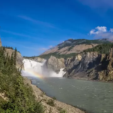 Virginia Falls in mist and water mist rainbow at South Nahanni river, Northwest Territories, Canada