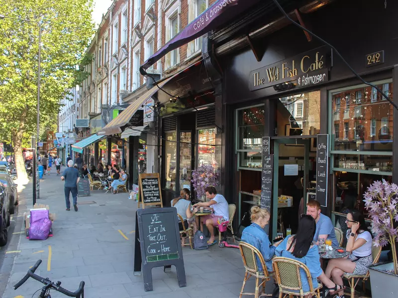 People eating at a cafe in West Hampstead, North London.