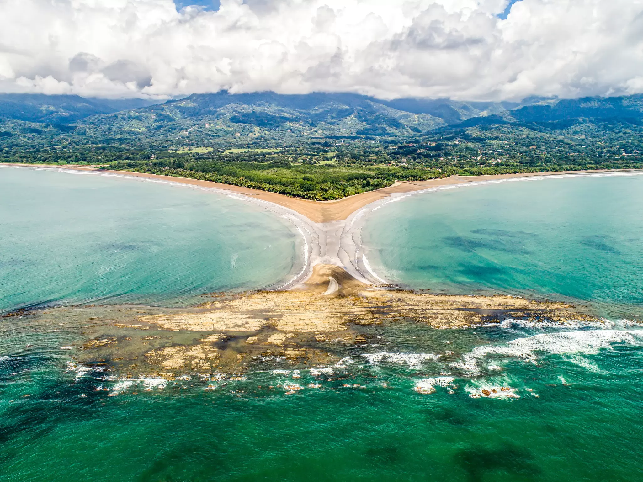 Aerial view of the National Park Punta Uvita on the Pacific coast of Costa Rica, shaped like a whale tail.