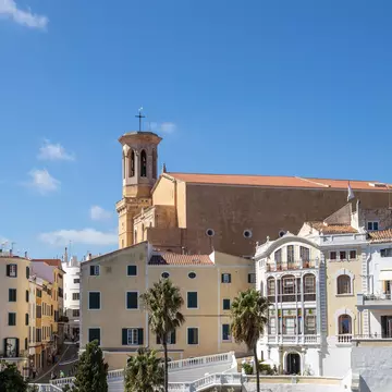 View of the Església de Santa Maria, visible over the town of Maó on the island of Menorca in Spain.