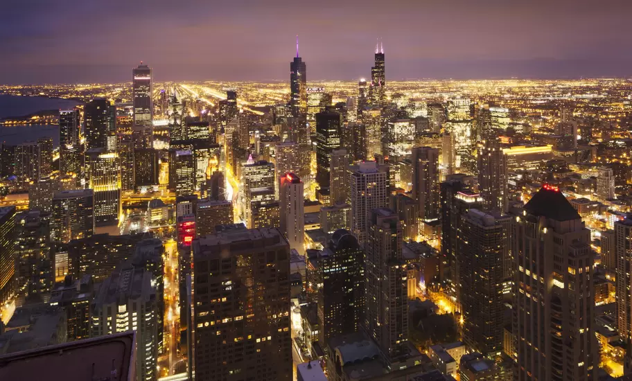 Overview of bright lights of Chicago at night.
