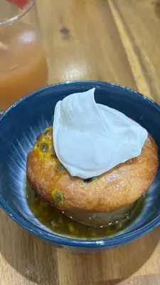 A sponge dessert with a cream topping