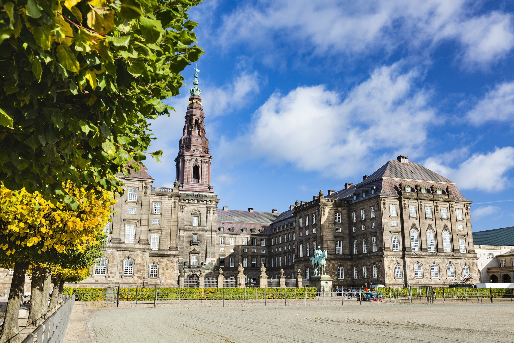 Trees and courtyard in front of Christiansborg Palace in Copenhagen, Denmark.