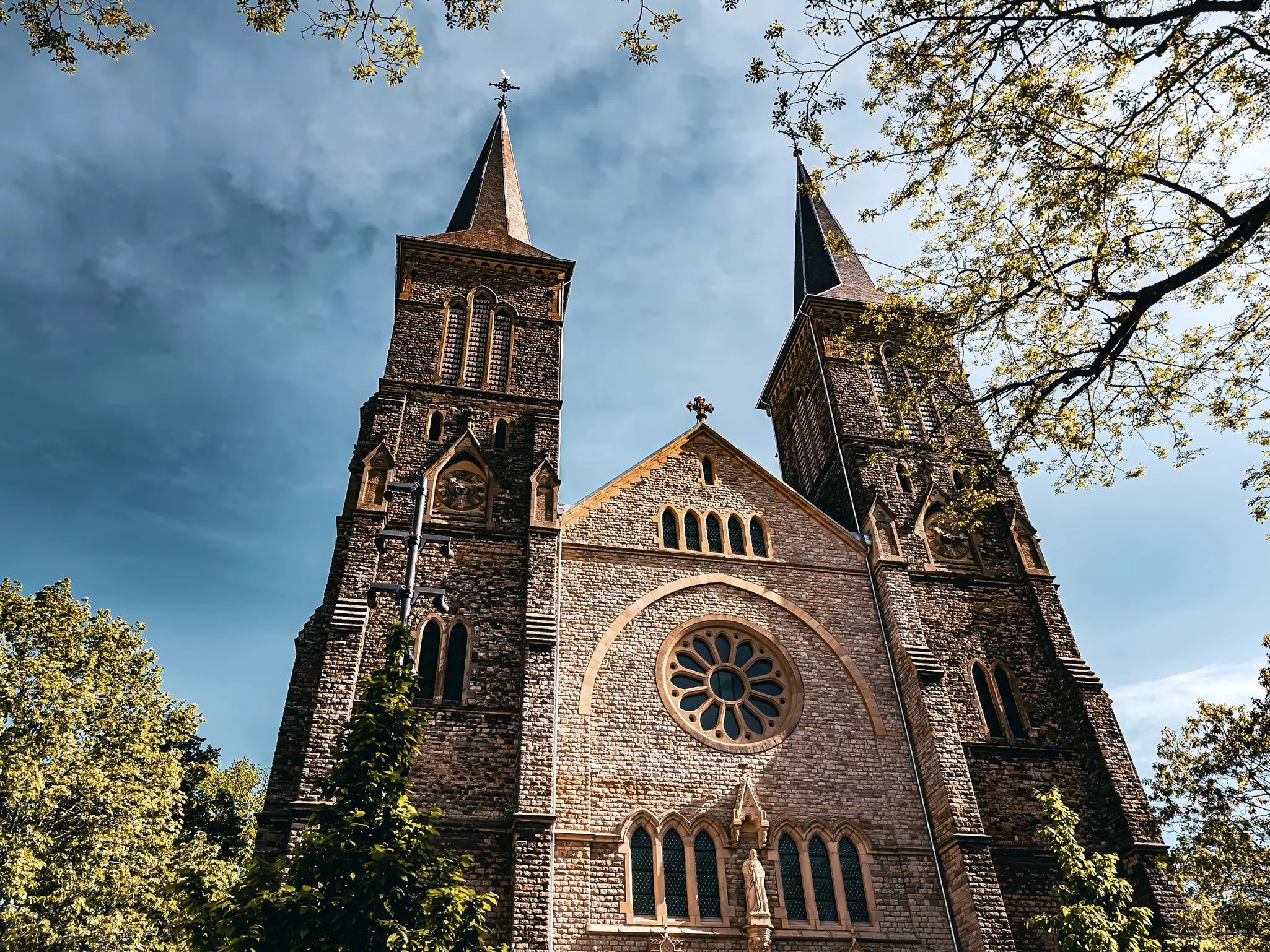 A traditional stone-fronted church in Dudelange, Luxembourg.