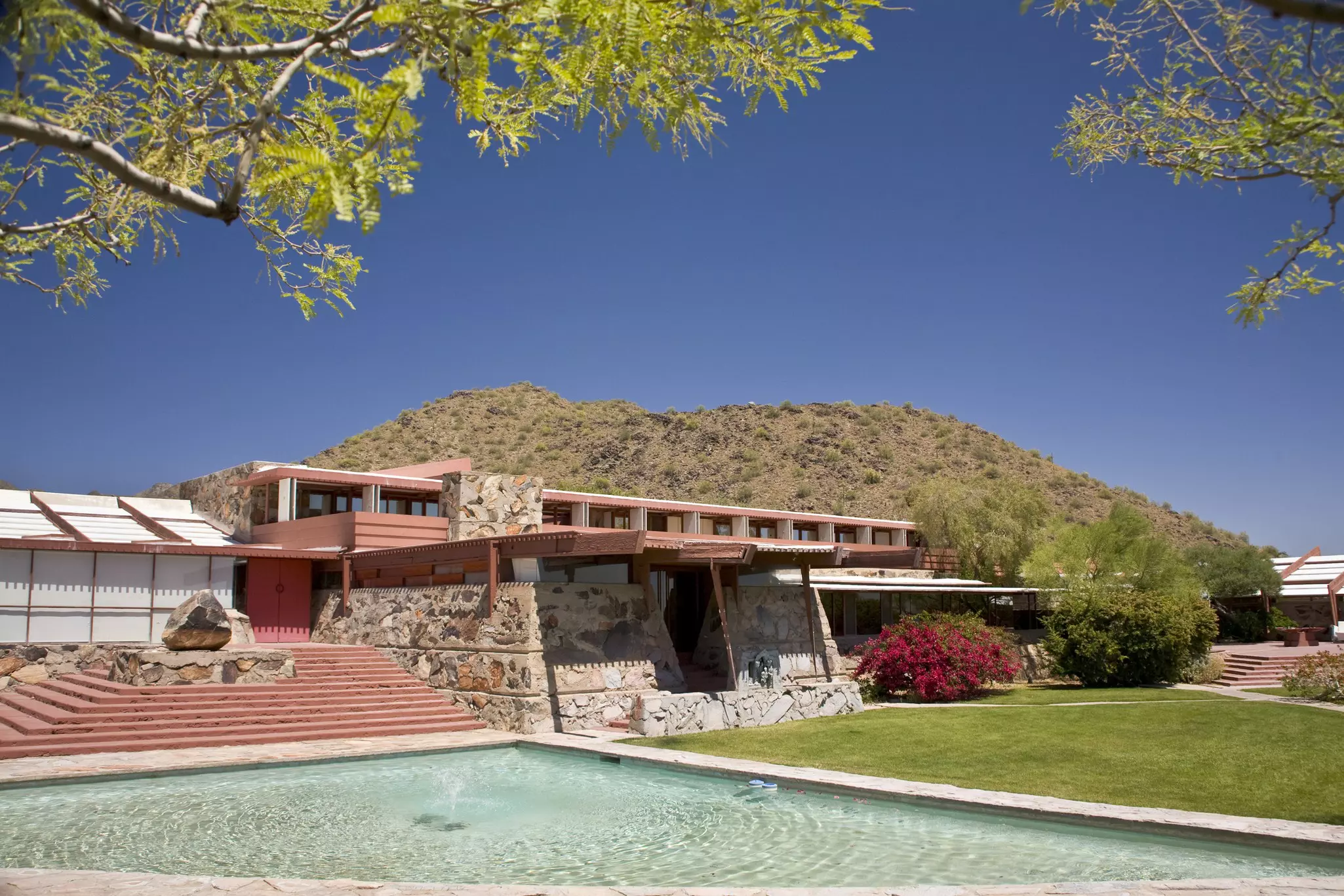 exterior of the low-slung desert building designed by Frank Lloyd Wright called Taliesin West 
