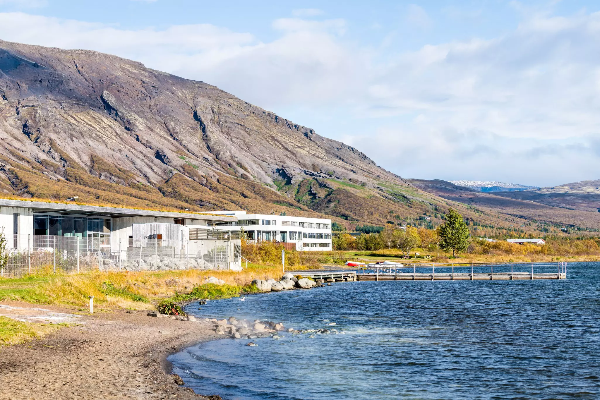 Fontana hot springs building by lake shore with Icelandic nordic Scandinavian modern architecture during day on golden circle