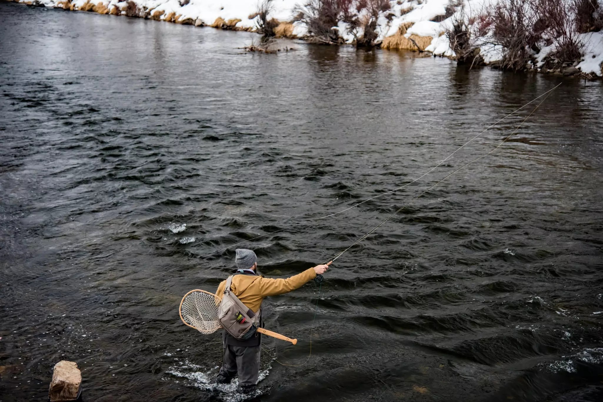 Book a guide to experience the thrill of winter fly-fishing when in Park City, Utah. Layne V. Naylor/Shutterstock