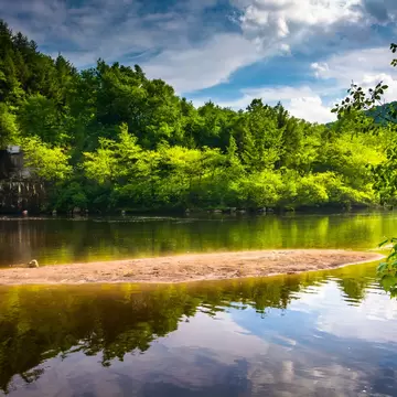 The Lehigh River, with the trees and sky reflected in the water