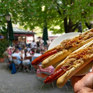 german bavarian hot dog in viktualienmarkt munich with sauerkraut street food ., License Type: media, Download Time: 2025-11-14T02:08:08.000Z, User: katherineeloisemarsh73, Editorial: false, purchase_order: 56530 - Guidebooks, job: Global Publishing-WIP, client: Munich Bavaria & the Black Forest 9, other: Kat/Marsh