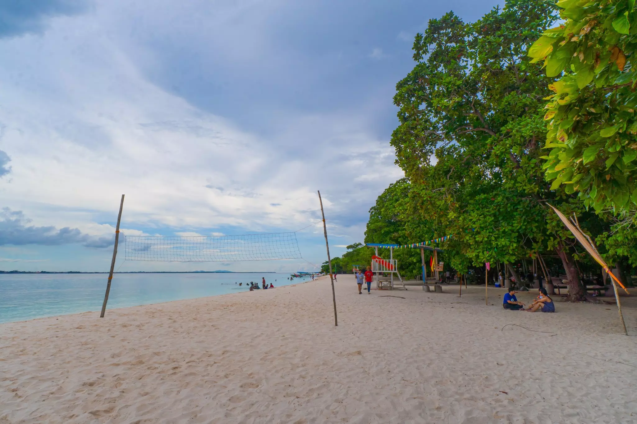 A volleyball net on the tree-lined beach on Santa Cruz Island. 