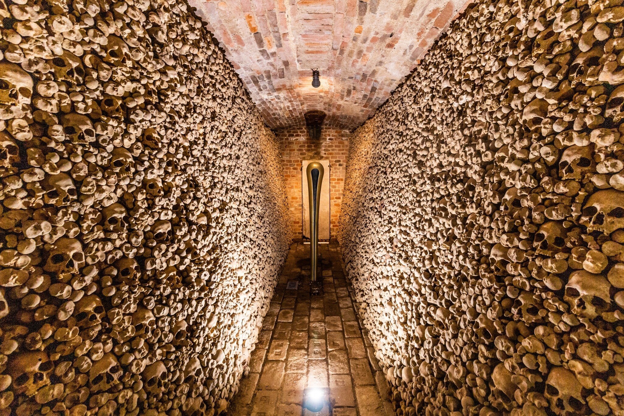 Underground ossuary under the Church of St. James in Brno, Czech Republic. Wall of skulls.