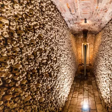 Underground ossuary under the Church of St. James in Brno, Czech Republic. Wall of skulls.